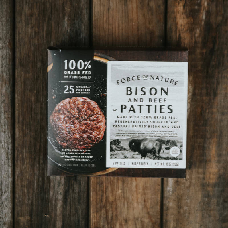 Bison & Beef Patties box on a wooden table.