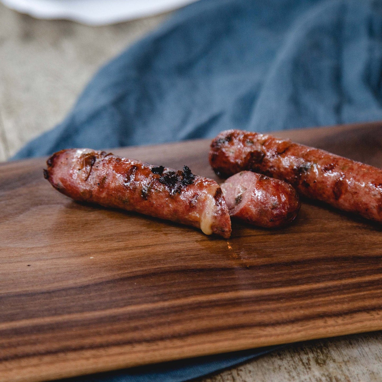Sausage links on a wooden board.