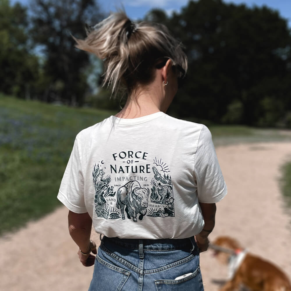 Back of a woman wearing a Texas Wildlife t-shirt.