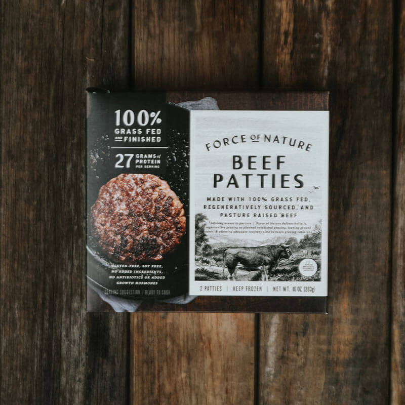 Force of Nature beef patties box on a wooden table.