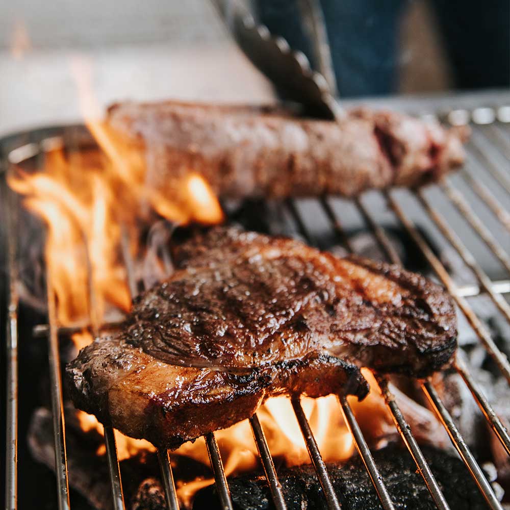 Meat cooking on a grill.